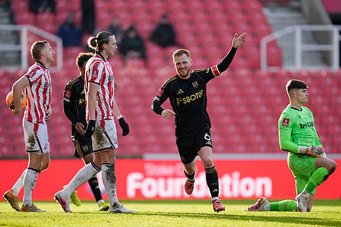 Fulham's Harrison Reed celebrates after scoring his sides second goal  during the English FA Cup fourth round match between Stoke City and Fulham, in Stoke, England.