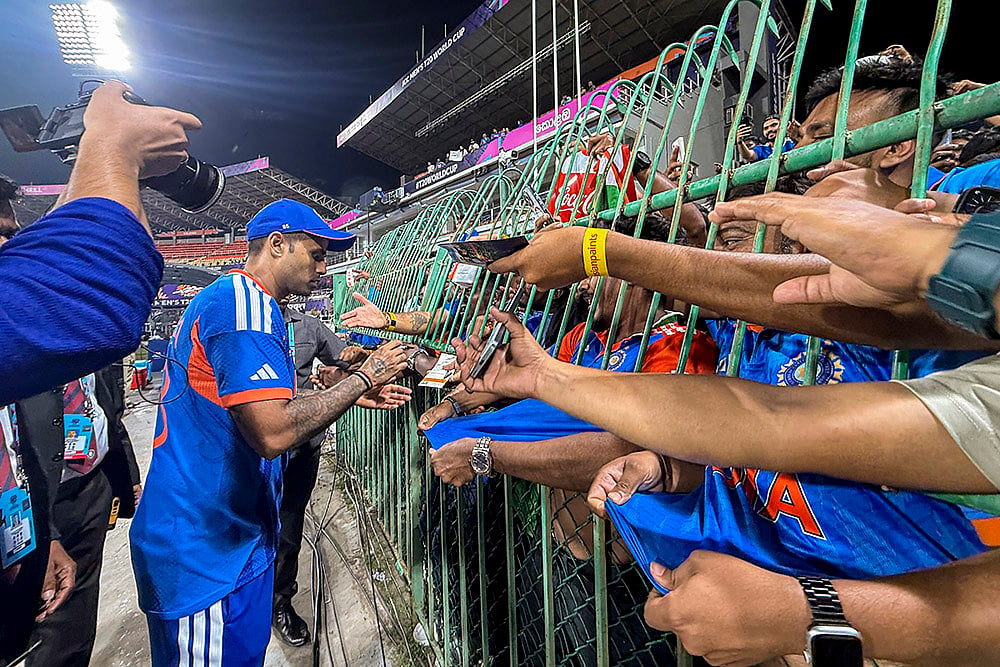 | Photo: PTI/Arun Sharma : India's captain Suryakumar Yadav signs autographs for fans after winning the ICC Men's T20 World Cup 2026 cricket match between India and Pakistan, at R Premadasa Stadium, in Colombo, Sri Lanka.