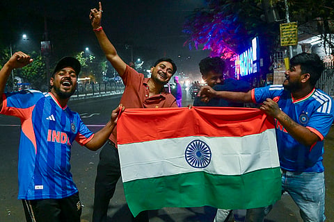 Cricket fans celebrate India's victory over Pakistan in the ICC Men's T20 World Cup 2026 cricket match, in Kolkata.