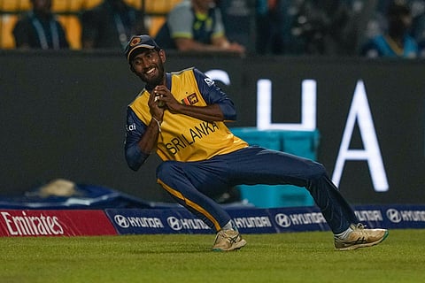 Sri Lanka's Dushan Hemantha takes the catch to get Australia's Tim David during the T20 World Cup cricket match between Sri Lanka and Australia in Pallekele, Sri Lanka.