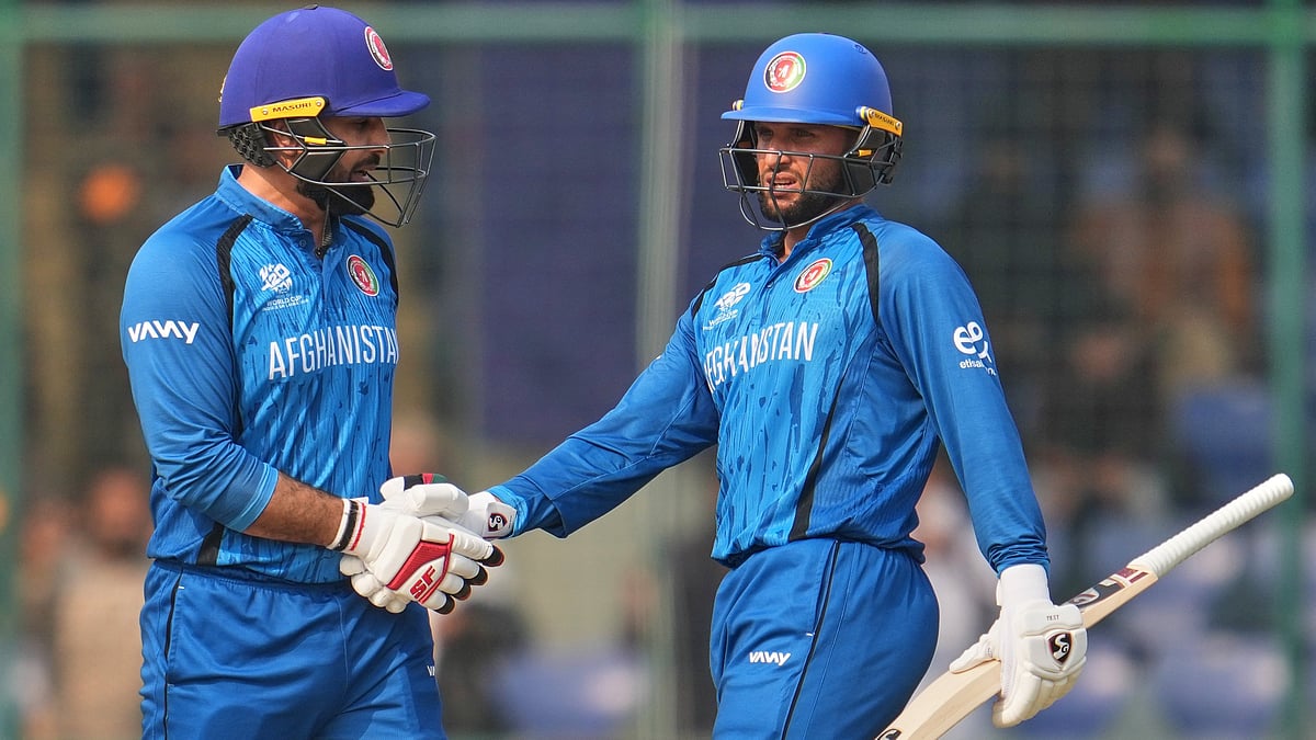 (AP Photo/Manish Swarup) : Afghanistan's Azmatullah Omarzai, right, and Mohammad Nabi celebrate after winning the T20 World Cup cricket match between Afghanistan and United Arab Emirates in New Delhi, India, Monday, Feb. 16, 2026