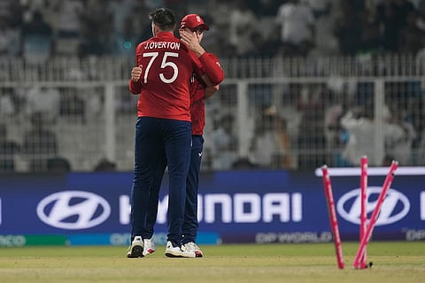 England's Jamie Overton celebrates with teammates the wicket of Italy's Jaspreet Singh during the T20 World Cup cricket match between England and Italy in Kolkata, India.