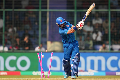 Afghanistan's Darwish Rasooli bowled out by United Arab Emirates' Junaid Siddique during the T20 World Cup cricket match between Afghanistan and United Arab Emirates in New Delhi.