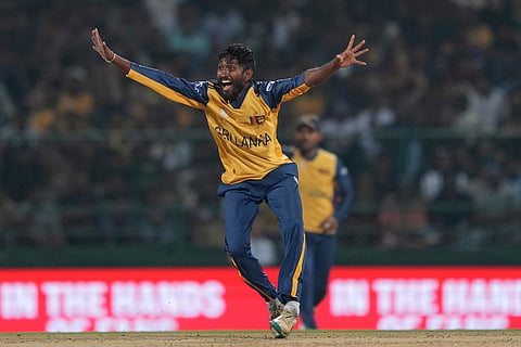 Sri Lanka's Dushan Hemantha celebrates the wicket of Australia's captain Mitchell Marsh during the T20 World Cup cricket match between Sri Lanka and Australia in Pallekele, Sri Lanka.