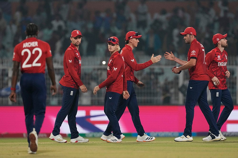 | Photo: AP/Bikas Das : England's captain Harry Brook, centre, celebrates with teammates after winning the T20 World Cup cricket match against Italy in Kolkata, India.