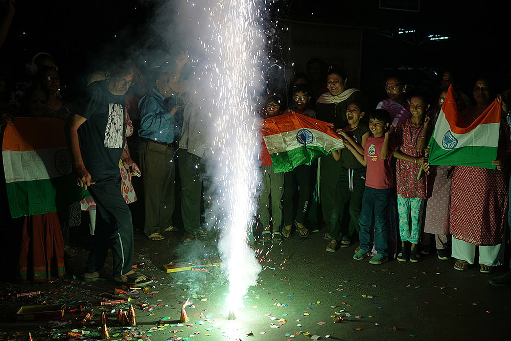 Fans celebrate Indias T20 World Cup win over Pakistan in Ahmedabad