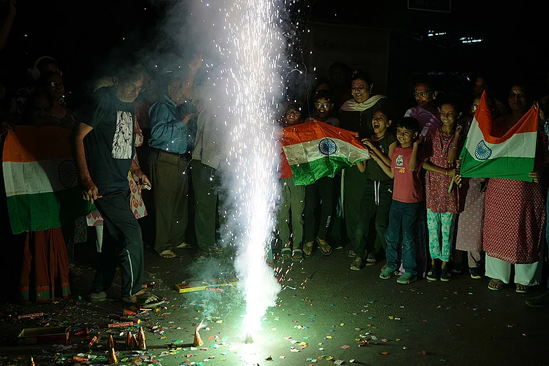 Fans celebrate Indias T20 World Cup win over Pakistan in Ahmedabad