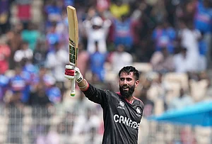 | Photo: AP/Mahesh Kumar A. : Canada's Yuvraj Samra celebrates his century during the T20 World Cup cricket match between Canada and New Zealand in Chennai.