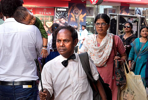 Fifty-year-old Afsar Khan performs as Charlie Chaplin in the bustling lanes of Dadar, having travelled 55 km from Mumbra to Mumbai—bringing silent-era charm and fleeting laughter to the city’s weekend crowds.