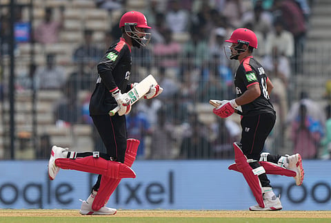 Canada's captain Dilpreet Bajwa, right, and Yuvraj Samra run between the wickets during the T20 World Cup cricket match between Canada and New Zealand in Chennai.