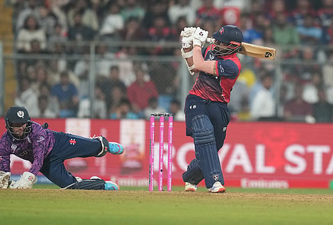 Nepal's Gulshan Jha plays a shot during the T20 World Cup cricket match between Nepal and Scotland in Mumbai.