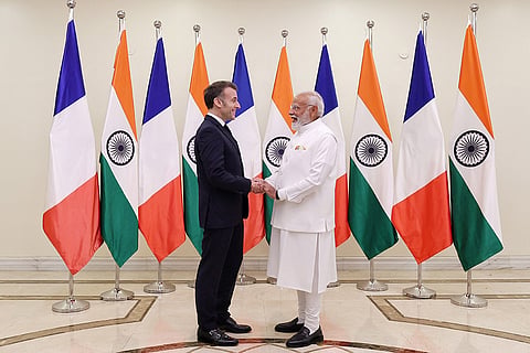 In this image received on Feb. 17, 2026, Prime Minister Narendra Modi with French President Emmanuel Macron during a meeting, in Mumbai.
