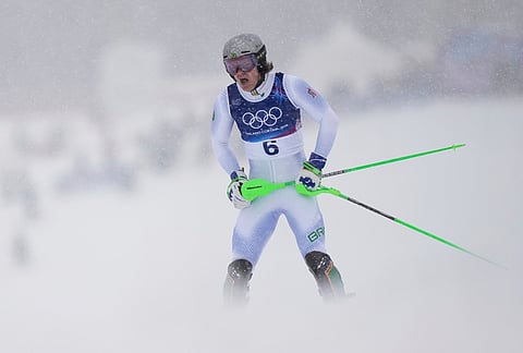 Brazil's Lucas Pinheiro Braathen reacts after crashing during an alpine ski, men's slalom race, at the 2026 Winter Olympics, in Bormio, Italy.
