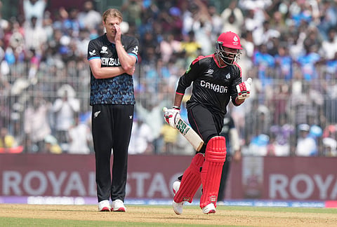 Canada's Yuvraj Samra, right, celebrates his century during the T20 World Cup cricket match between Canada and New Zealand in Chennai.