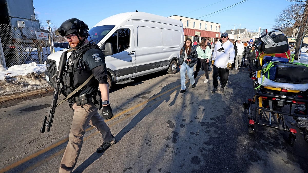 AP Photo : Witnesses follow police outside of the Lynch Arena in Pawtucket, Rhode Island., after a shooting at the ice rink.