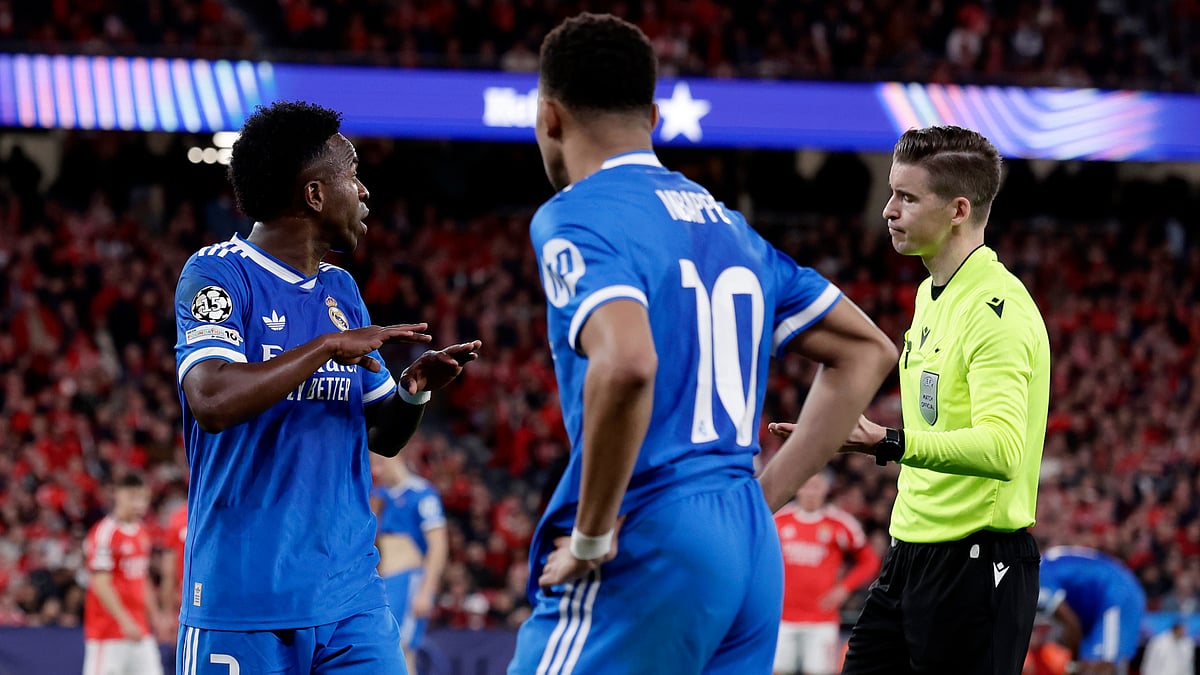 Vinicius Junior speaks to referee Francois Letexier - null