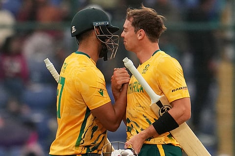 South Africa's Jason Smith, left, congratulates Tristan Stubbs after winning the T20 World Cup cricket match between South Africa and United Arab Emirates in New Delhi.