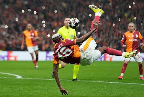 Galatasaray's Victor Osimhen makes a bicycle kick during a Champions league play-off first leg soccer match between Galatasaray and Juventus, in Istanbul, Turkey.