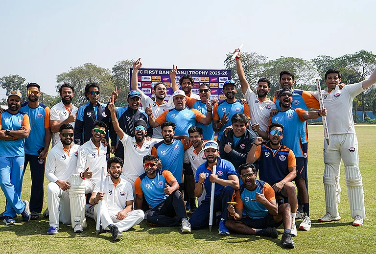 Jammu and Kashmir players with their coach and support staff pose for a group photo after their victory in the Ranji Trophy semifinal cricket match against Bengal, at the Bengal Cricket Academy Ground, in Kalyani, West Bengal. - | Photo: PTI/Manvender Vashist Lav