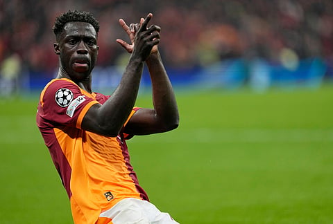 Galatasaray's Davinson Sanchez celebrates after scoring his side's third goal during a Champions league play-off first leg soccer match between Galatasaray and Juventus, in Istanbul, Turkey.