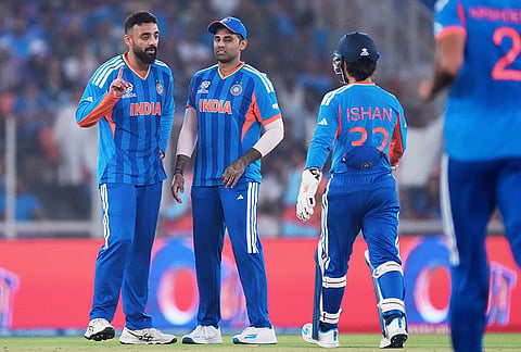 India's Varun Chakravarthy, left, celebrates with teammates the wicket of Netherlands' Max O'Dowd during the T20 World Cup cricket match between India and Netherlands in Ahmedabad.
