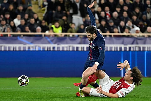 Monaco's Folarin Balogun celebrates with teammates after scoring his side's second goal during the first-leg of the Champions League playoff soccer match between Monaco and Paris Saint-Germain in Monaco.
