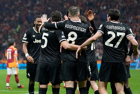 Juventus' Teun Koopmeiners, center, celebrates with teammates after scoring his side's second goal during a Champions league play-off first leg soccer match between Galatasaray and Juventus, in Istanbul, Turkey.
