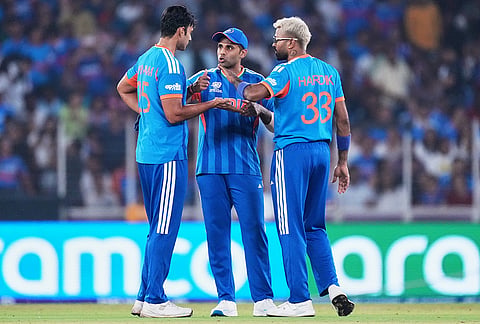 India's Shivam Dube, left, captain Suryakumar Yadav and Hardik Pandya have a chat during the T20 World Cup cricket match between India and Netherlands in Ahmedabad.