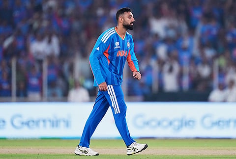 India's Varun Chakravarthy celebrates the wicket of Netherlands' Aryan Dutt during the T20 World Cup cricket match between India and Netherlands in Ahmedabad.