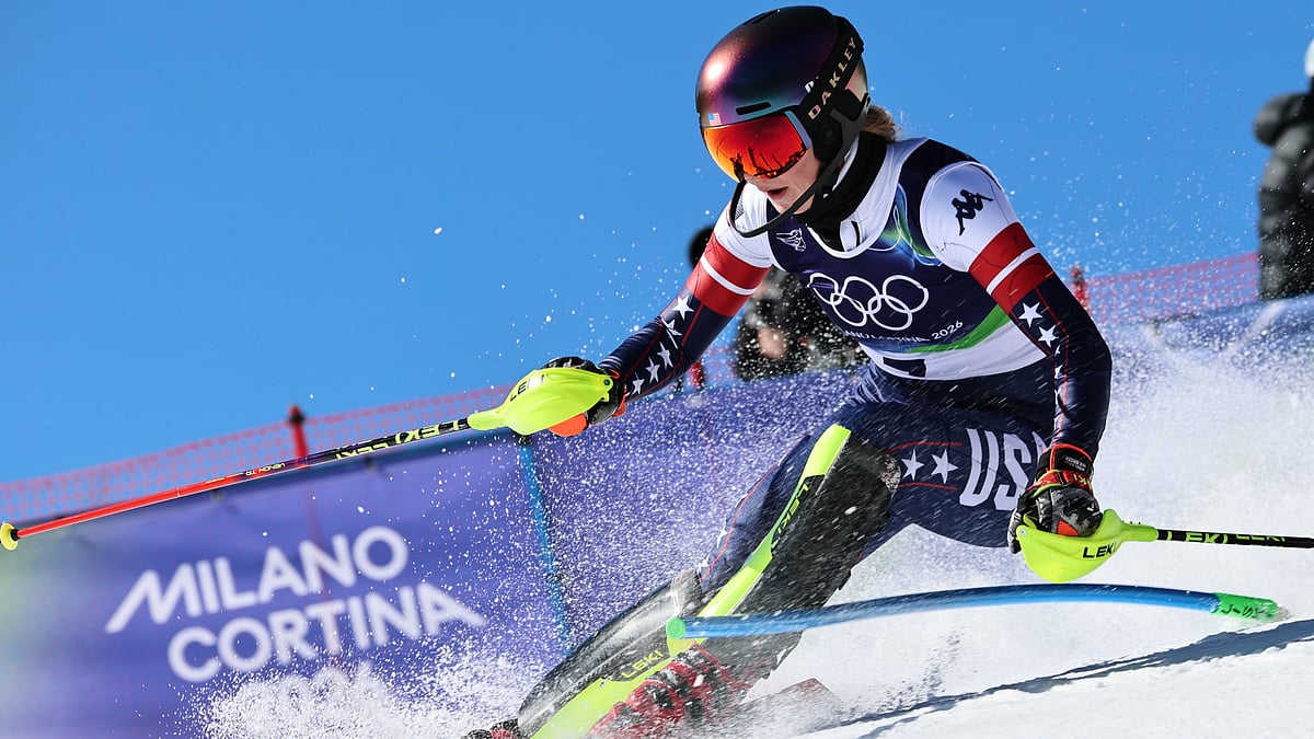 (AP Photo/Marco Trovati) : United States' Mikaela Shiffrin speeds down the course during an alpine ski, women's slalom race, at the 2026 Winter Olympics, in Cortina d'Ampezzo, Italy, Wednesday, Feb. 18, 2026. 
