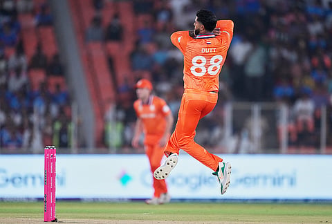 Netherlands' Aryan Dutt bowls a delivery during the T20 World Cup cricket match between India and Netherlands in Ahmedabad.