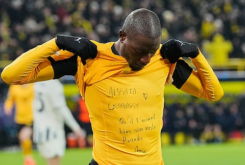 Dortmund's scorer Serhou Guirassy celebrates his opening goal with a message to his deceased niece Aissata Guirassy on his shirt during the Champions League Knockout playoff 1st leg soccer match between Borussia Dortmund and Atalanta in Dortmund, Germany.