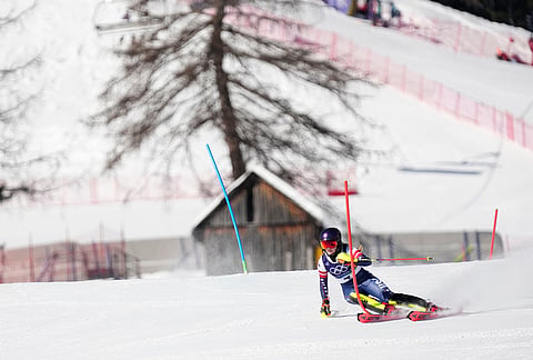 United States' Mikaela Shiffrin competes in at the finish area of an alpine ski, women's slalom race, at the 2026 Winter Olympics, in Cortina d'Ampezzo, Italy.