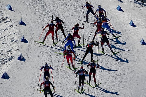 Athletes compete in the cross-country skiing women's team sprint free at the 2026 Winter Olympics, in Tesero, Italy.
