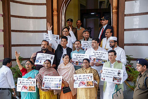 RJD MLA Rabri Devi, front centre, and other legislators stage a protest over various issues during the Budget session of the Bihar Assembly, in Patna.