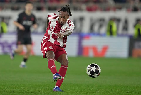 Olympiacos' Gelson Martins shoots during a Champions League playoff soccer match between Olympiacos and Bayer 04 Leverkusen in Piraeus port, near Athens.