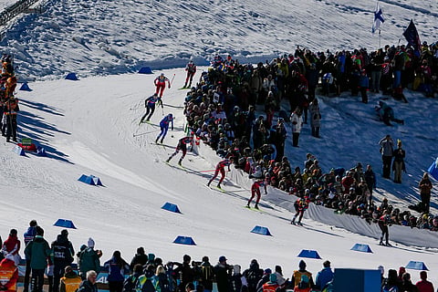 Alison Mackie, of Canada, Nadja Kaelin, of Switzerland, and Astrid Oeyre Slind, of Norway, from right, compete in the cross-country skiing women's team sprint free at the 2026 Winter Olympics, in Tesero, Italy.
