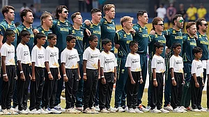 AP : Australia's players line up for the national anthems before the start of their T20 World Cup match against Zimbabwe in Colombo.