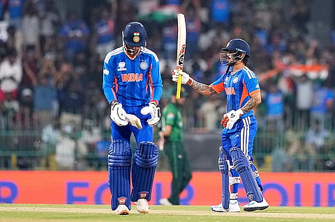 India's Ishan Kishan, right, celebrates his fifty runs as batting partner Tilak Varma looks on during the T20 World Cup cricket match between India and Pakistan in Colombo, Sri Lanka.