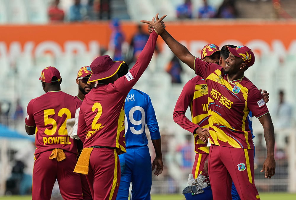 | Photo: AP/Bikas Das : West Indies players celebrate after they won the T20 World Cup cricket match against Italy in Kolkata.