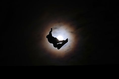 New Zealand's Dane Menzies practices before the men's snowboarding slopestyle finals at the 2026 Winter Olympics, in Livigno, Italy.