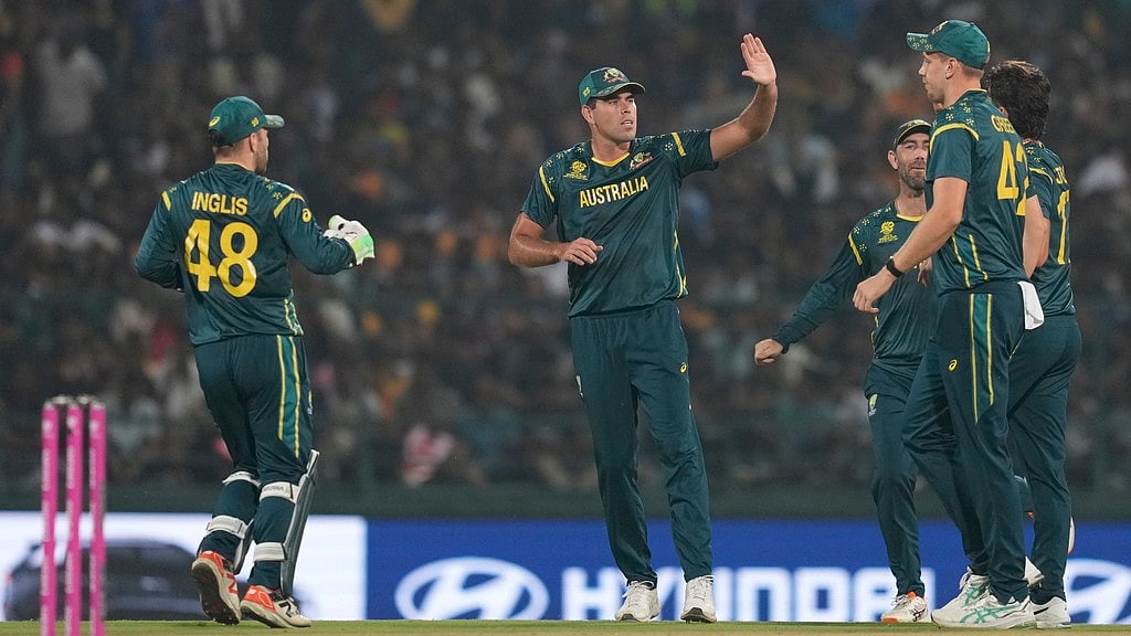 AP : Australia's players celebrate the wicket of Sri Lanka's Kusal Perera during their T20 World Cup match in Pallekele.