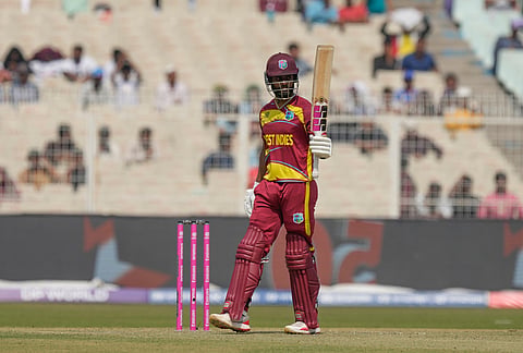 West Indies' captain Shai Hope celebrates his fifty runs during the T20 World Cup cricket match between West Indies and Italy in Kolkata.