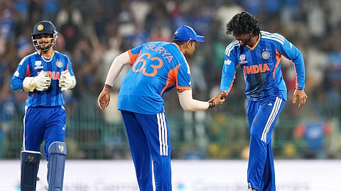 India's Tilak Varma, right, and captain Suryakumar Yadav celebrate the wicket of Pakistan's Shadab Khan during the T20 World Cup cricket match between India and Pakistan in Colombo, Sri Lanka, Sunday, Feb. 15, 2026. 