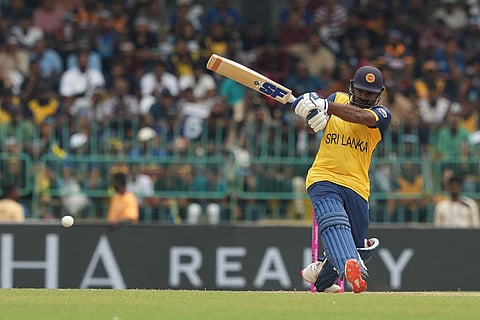 Sri Lanka's Kusal Perera plays a shot during the T20 World Cup cricket match between Sri Lanka and Zimbabwe in Colombo, Sri Lanka.