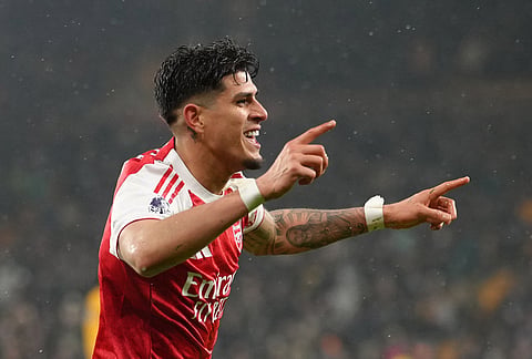 Arsenal's Piero Hincapie celebrates after scoring his side the second goal during the Premier League soccer match between Wolverhampton Wanderers and Arsenal in Wolverhampton, England.