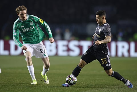 Qarabag's Pedro Bicalho, right, fights for the ball with Newcastle's Nick Woltemade during the Champions League play-off first leg soccer match between Qarabag and Newcastle in Baku, Azerbaijan.