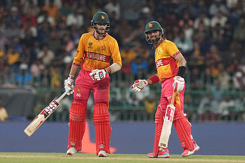 Zimbabwe's captain Sikandar Raza, right, and Brian Bennett during the T20 World Cup cricket match between Sri Lanka and Zimbabwe in Colombo, Sri Lanka.