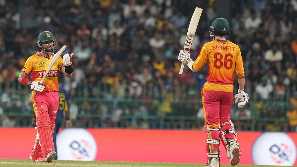 AP Photo/Eranga Jayawardena : Zimbabwe's Brian Bennett, right, celebrates his fifty runs during the T20 World Cup cricket match between Sri Lanka and Zimbabwe in Colombo, Sri Lanka, Thursday, Feb. 19, 2026. 