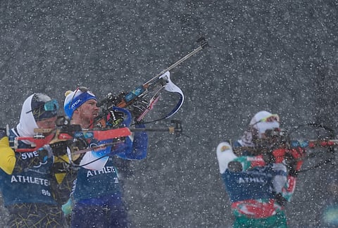 Vitezslav Hornig, of Czechia, center, participates in a biathlon training session at the 2026 Winter Olympics in Anterselva, Italy.